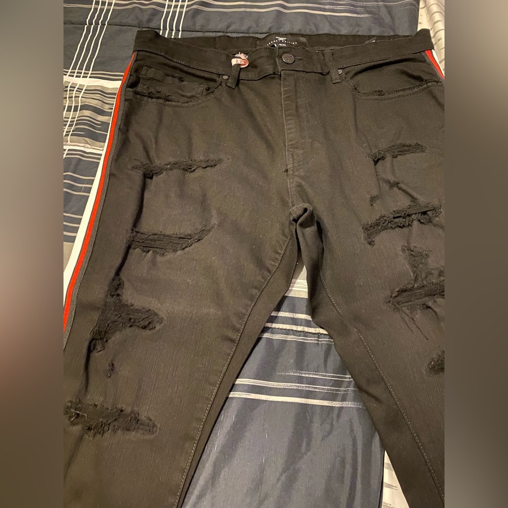 Distressed men jeans.